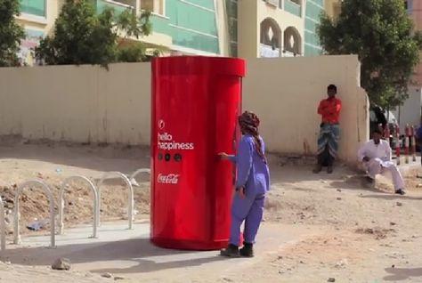 Coca-Cola example of corporate social responsibility: Installed phone boxes in drink dispensers in Dubai.