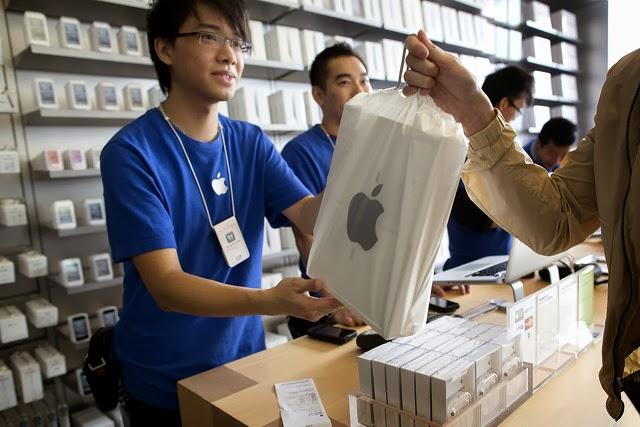 Apple's employees providing personal selling services to clients in one of the company's stores in China