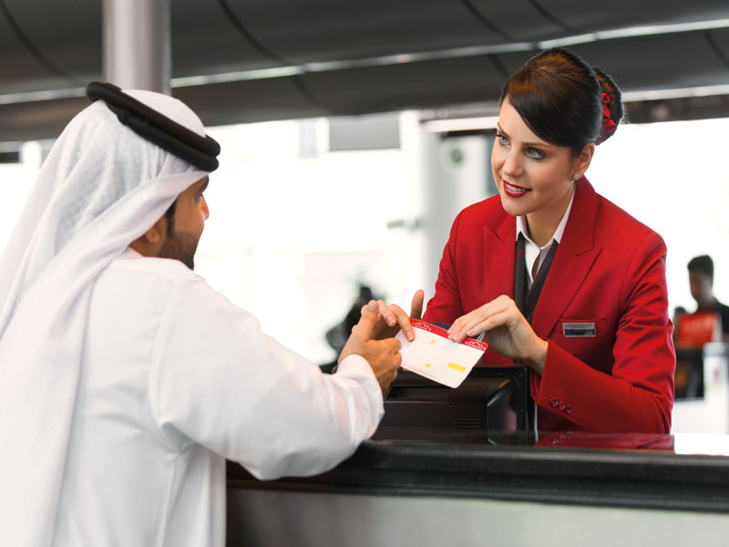 Air Arabia employee attending to a customer (Mills, 2017, p. 78).